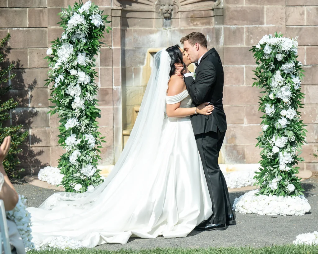 Ben and Aryana sharing their first kiss after their wedding ceremony at Tyler Gardens in Newtown, Pennsylvania