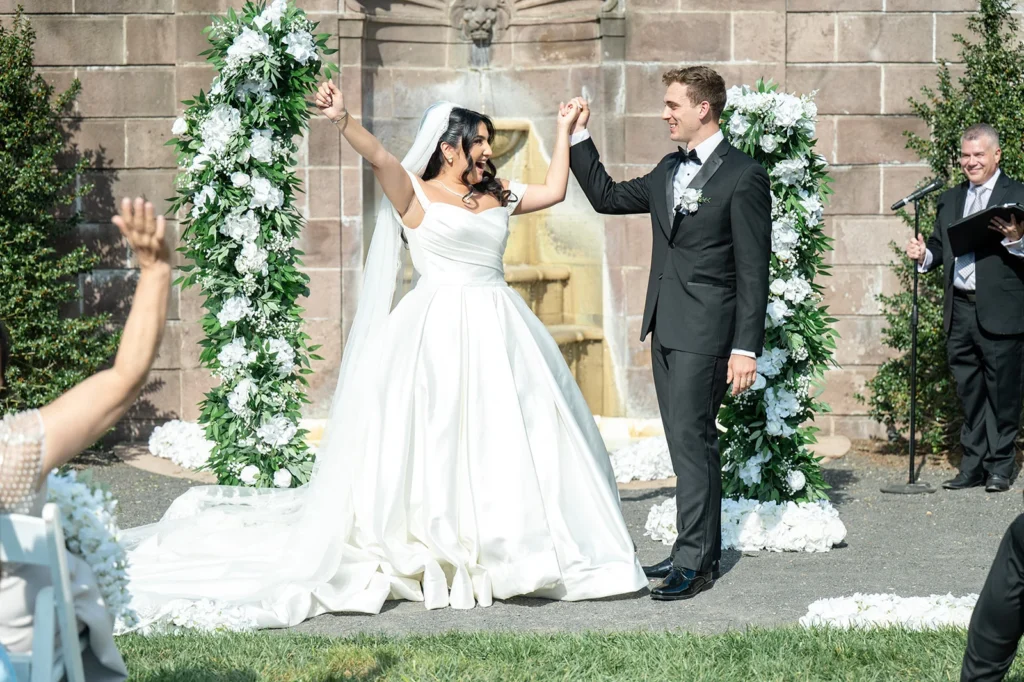 Ben and Aryana celebrating just after being pronounced married at Tyler Gardens in Newtown, Pennsylvania, with Ever After Vows officiating